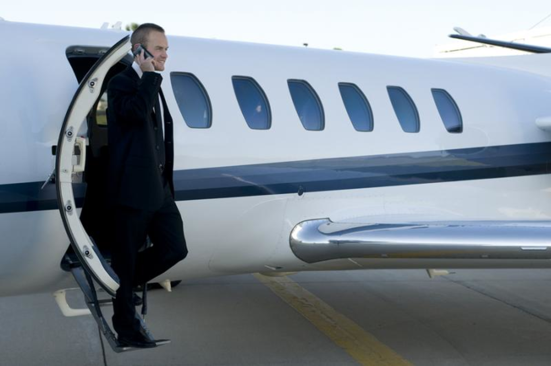 Bigstock Businessman On Cell Phone Exit 5571110 0