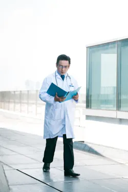 Doc Looking At Record Doc Looking At Record