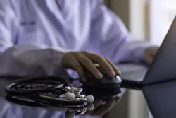 Doctor Working Computer 60243f12d964c Doctor Working Computer 60243f12d964c