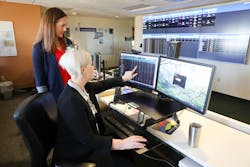 Stephanie Gilliam, M.N., R.N., director of Mission Control at OHSU, left, and Rachel Adair, M.S.N., R.N., assistant director of the transfer center at OHSU, discuss data on the new Oregon Behavioral Health Coordination Center dashboard. Stephanie Gilliam, M.N., R.N., director of Mission Control at OHSU, left, and Rachel Adair, M.S.N., R.N., assistant director of the transfer center at OHSU, discuss data on the new Oregon Behavioral Health Coordination Center dashboard.