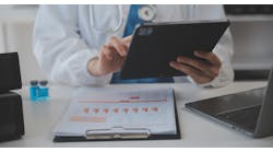 Professional Lab Amazing Longhaired Medical Worker Wearing Uniform While Using Microscope During Research Professional Lab Amazing Longhaired Medical Worker Wearing Uniform While Using Microscope During Research