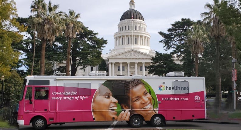 A Health Net mobile health unit is parked in front of the California State Capitol building in Sacramento.