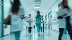 Blurred photo of health care professionals rushing in a hospital. Blurred photo of health care professionals rushing in a hospital.