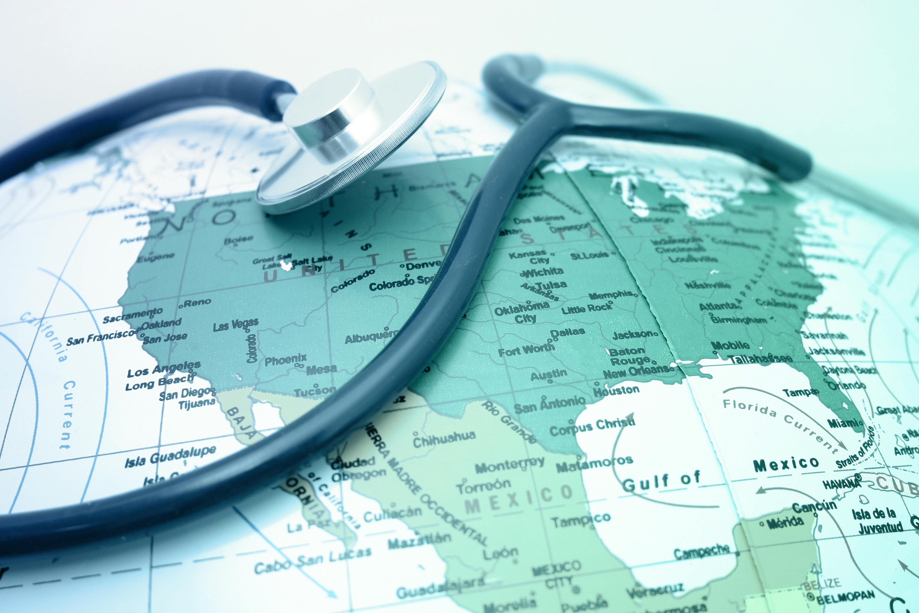 Image of a telescope laying across a globe section showing the United States.