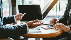 Business consulting meeting with executives brainstorming new business and investment opportunities. Business consulting meeting with executives brainstorming new business and investment opportunities.