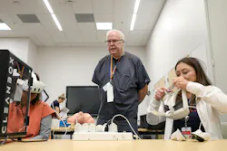 Quentin Hart, VASNHS Simulation Coordinator, provides instruction on using the VR simulation system to VASNHS staff at the Simulation Open House on May 14, 2025.